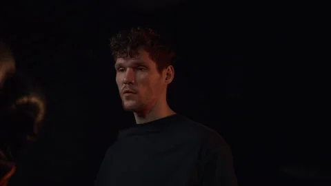 Female boxer executing a powerful punch during a training session with a focused Stock Footage 267766563