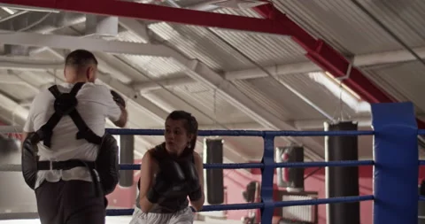 Female boxer practicing to evade opponent Stock Footage 228444613