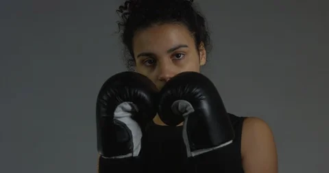 Female Boxer Prepping To Fight Throwing Punches Wearing Black Exercise Clothes Stock Footage 112764667