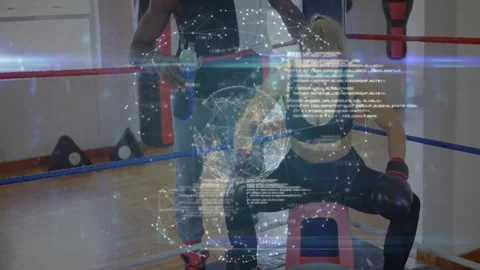 Female boxer resting in ring, trainer offering water, floating network lines Stock Footage 327359442