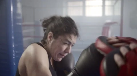 Female boxer training with boxing trainer close up Stock Footage 50382807