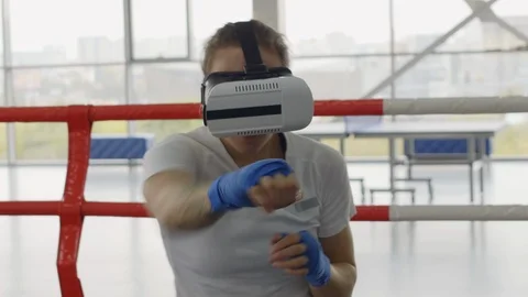 Female Boxer in VR Headset Training on Ring Vidéo 119089827
