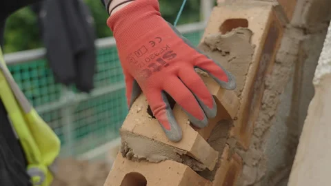 Female Bricklayer Lays Half Brick On Gable End 스톡 동영상 239755959