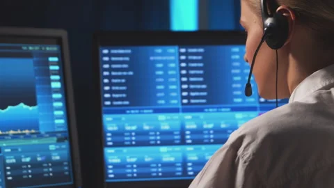 Female broker is workin in office using workstation and analysis technology Stock Footage 145487444