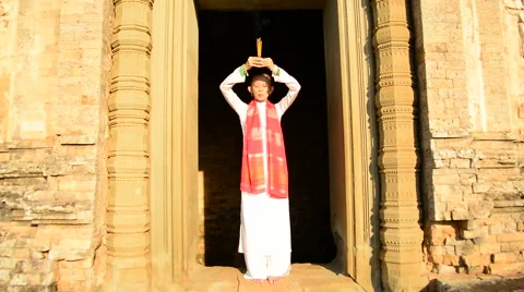 Female Buddhist Praying with Incense in Temple Doorway -   Angkor Wat Stock Footage