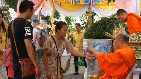 Female Buddhists receive blessing threads during Sonkran Festival 스톡 동영상 106706705