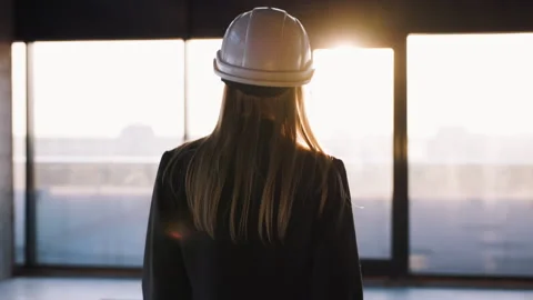 Female Building Architect Engineer Walking at Modern Unfinished Business Center Stock-Footage 245705750