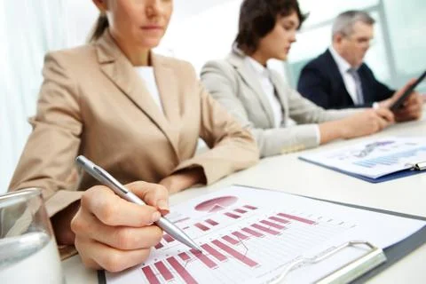 Female business lady carrying out the business data analysis Stock Photos