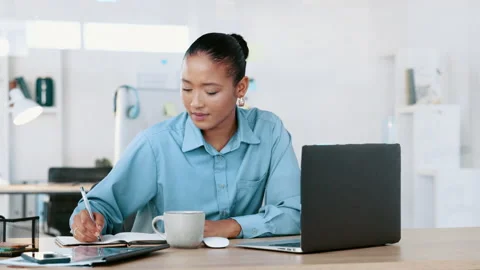Female business worker working on a computer while busy at an office desk Stock Footage 203812081