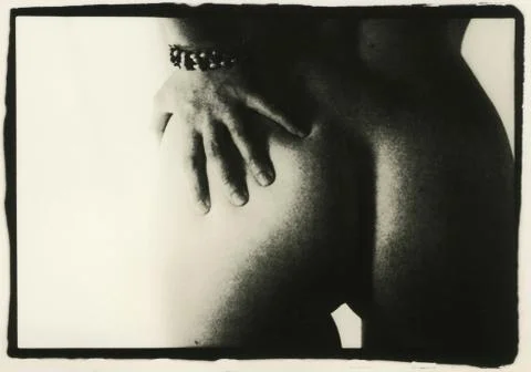 Female buttocks and hand. Stock Photos