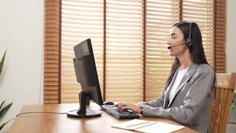 Female call center operator or customer service helpdesk staff. Blithe Video stock 256291401