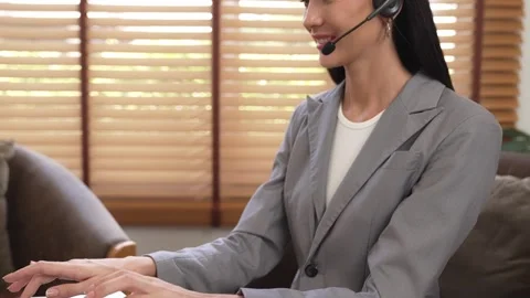 Female call center operator or customer service helpdesk staff. Blithe Stock Footage 256570701