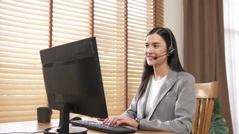 Female call center operator or customer service helpdesk staff. Blithe Stock Footage 256761877
