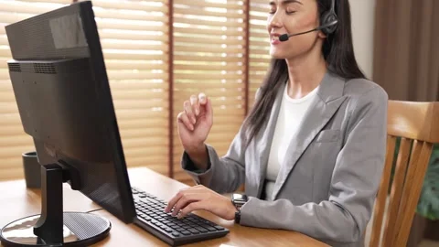 Female call center operator or customer service helpdesk staff. Blithe Video stock 264114983