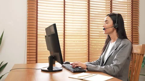 Female call center operator or customer service helpdesk staff. Blithe Stock Footage 267765540