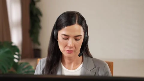 Female call center operator or customer service helpdesk staff. Blithe Video stock 270588685