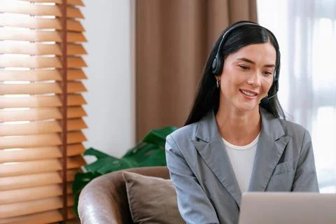 Female call center operator or customer service helpdesk staff. Blithe Stock Photos