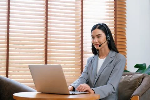 Female call center operator or customer service helpdesk staff. Blithe Stock Photos