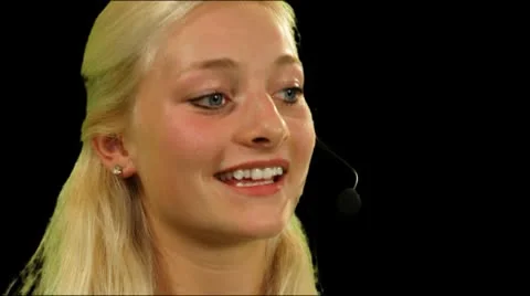 Female in call center talking on headphone Stock Footage