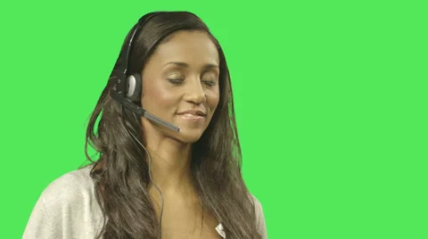 Female call centre worker speaking on headset Stock Footage 30520902