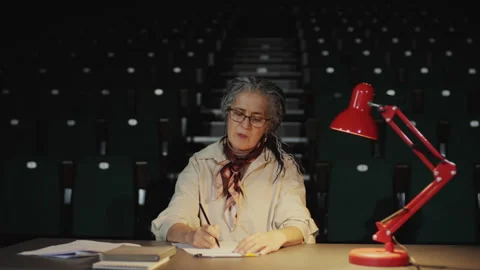 Female Casting Director Watching Actor and Taking Notes during Theatre Audition Stock Footage 279587744