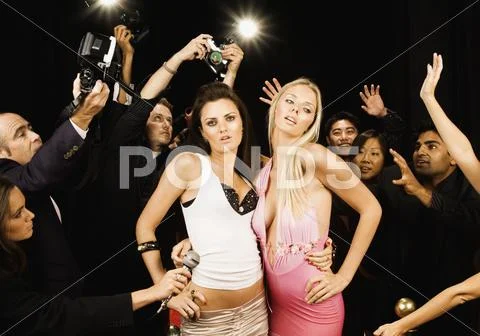 Female celebrities posing on the red carpet Stock Photos