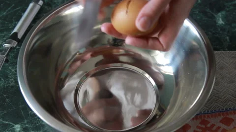 Female chef beating eggs with wire whisk in bowl Stock Footage 67586221