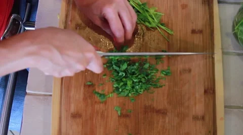 Female chef chopping Cilantro Stock Footage 45281591