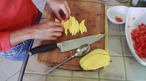 Female chef cutting a mango Stock Footage 45274793