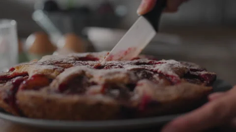 Female chef is preparing a fruit pie at home. Step-by-step home cooking tuto Stock Footage 250526915
