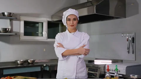 Female Chef in a Professional Kitchen Setting Stock Footage 299662199