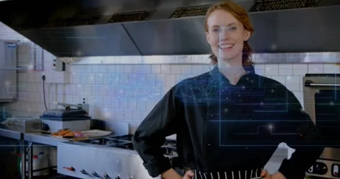 Female chef at restaurant counter camera zooming as interface appearing and 動画素材 320068959
