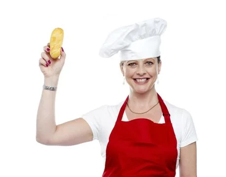 Female chef showing bread before baking it Stock Photos