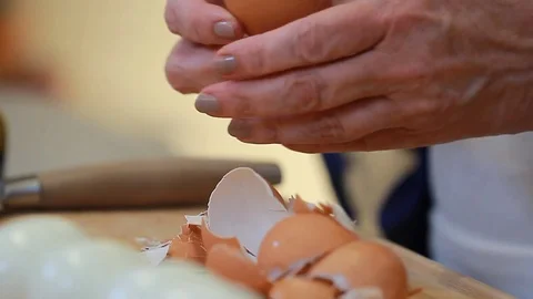 Female Chef's hands make Eggs salad Boiled Eggs Cutting on Chopping Board Stock Footage 77080751