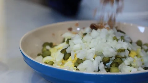 Female Chef's hands make Eggs salad Boiled Eggs Bakon Bits Video stock 77080802