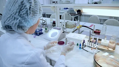 Female chemist research in lab Stock Footage 98599458