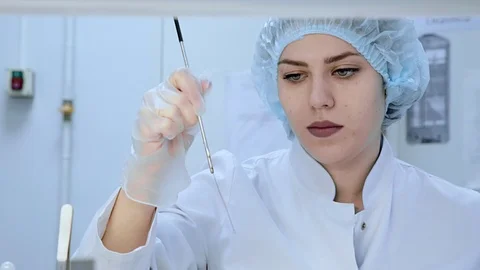 Female chemist research in lab Stock Footage 98599649