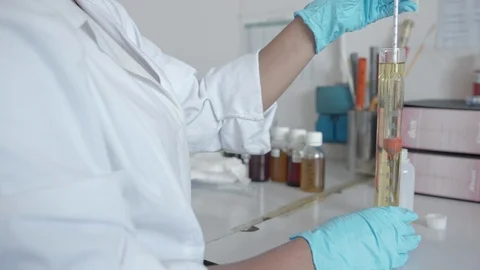 Female chemist testing oil Видео 117719764