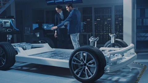 Female Chief Engineer Uses Tablet Computer, Introduces Autonomous Electric Car Stock Footage 106008271