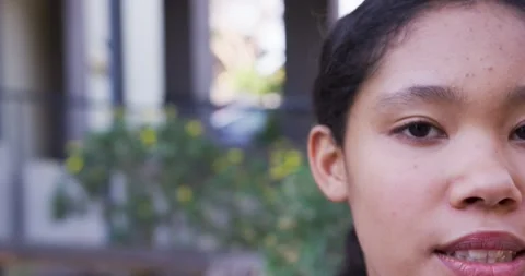 Female child speaking after camera prompt, blinking once and maintaining eye Stock Footage 340676269