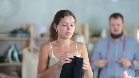Female client dissatisfied with quality of custom blazer Stock Footage 321728257