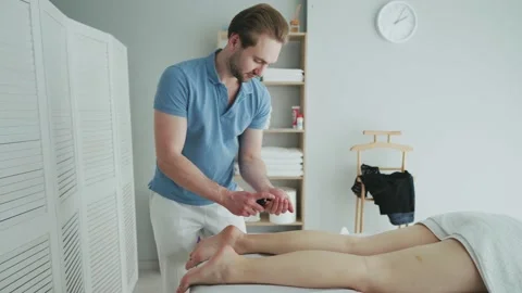 Female client getting back massage rejuvenating procedure in beauty clinic Stock Footage 181488470