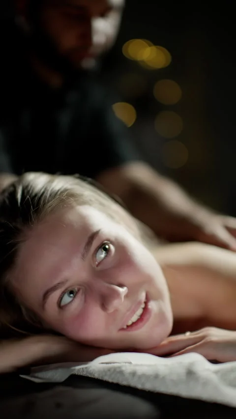 Female Client Smiling During Massage Therapy Session Stock Footage 261689286