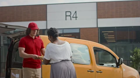 Female Client Taking Her Parcel from Courier near Delivery Van Video stock 280376467