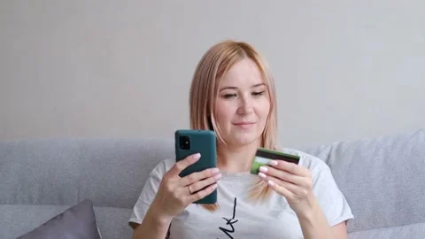 Female client using e-banking app on smartphone. Stock Footage 233179752