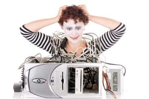 Female clown with broken computer Foto stock