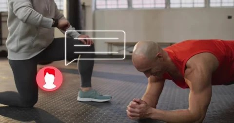 Female coach tapping smartwatch, app bubble appearing for gym feedback while Stock Footage 323336003