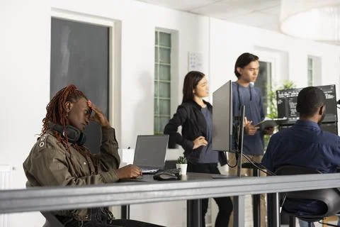 Female coder contemplating software solutions with hand on forehead Stock Photos