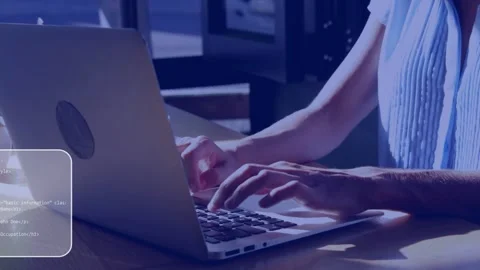 Female coder typing laptop faint code panels appearing while camera pulling back Stock Footage 335732003