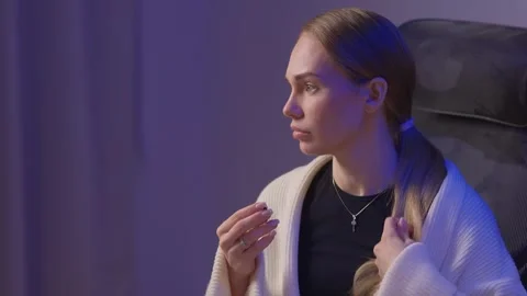 Female coder working. Female developer studying terminal output late at night Stock Footage 347879643